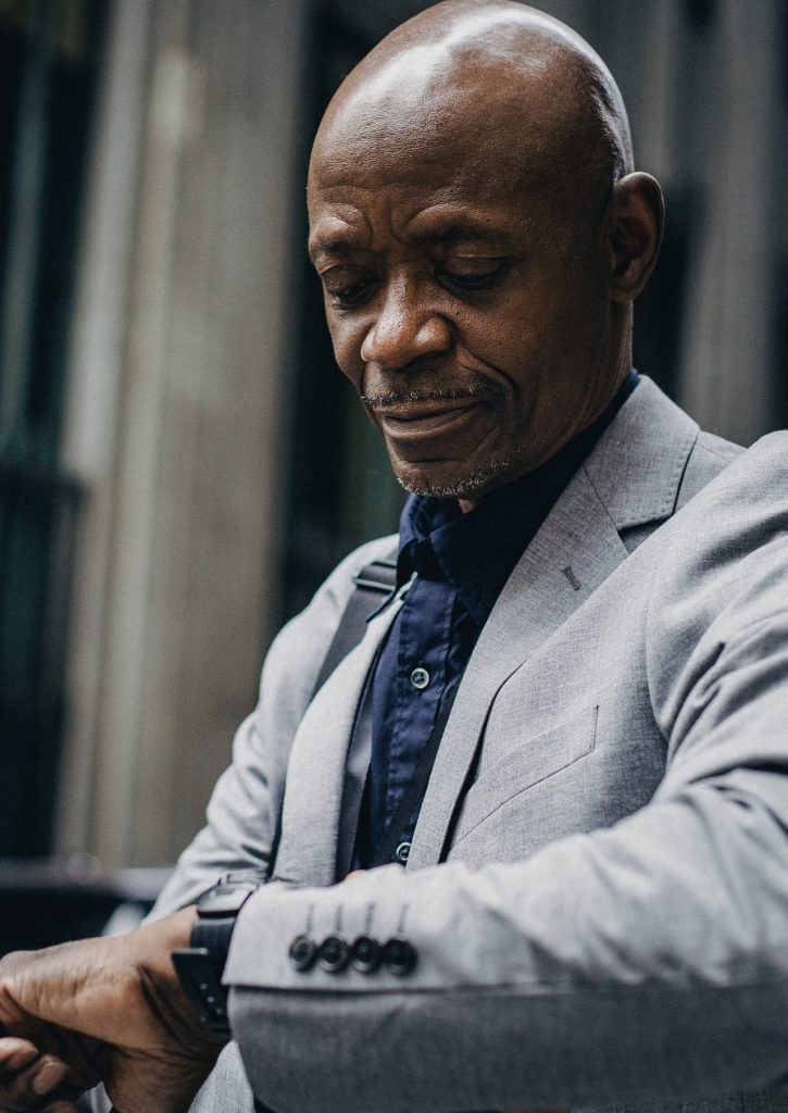 Business man Checking the Time on his watch